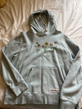 Life Is Good pastel blue hoodie with floral row graphic